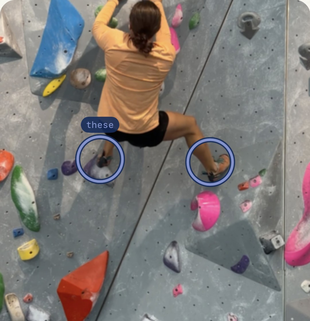 A climber with both feet circled where Trace saw a foot repositioned after placing it